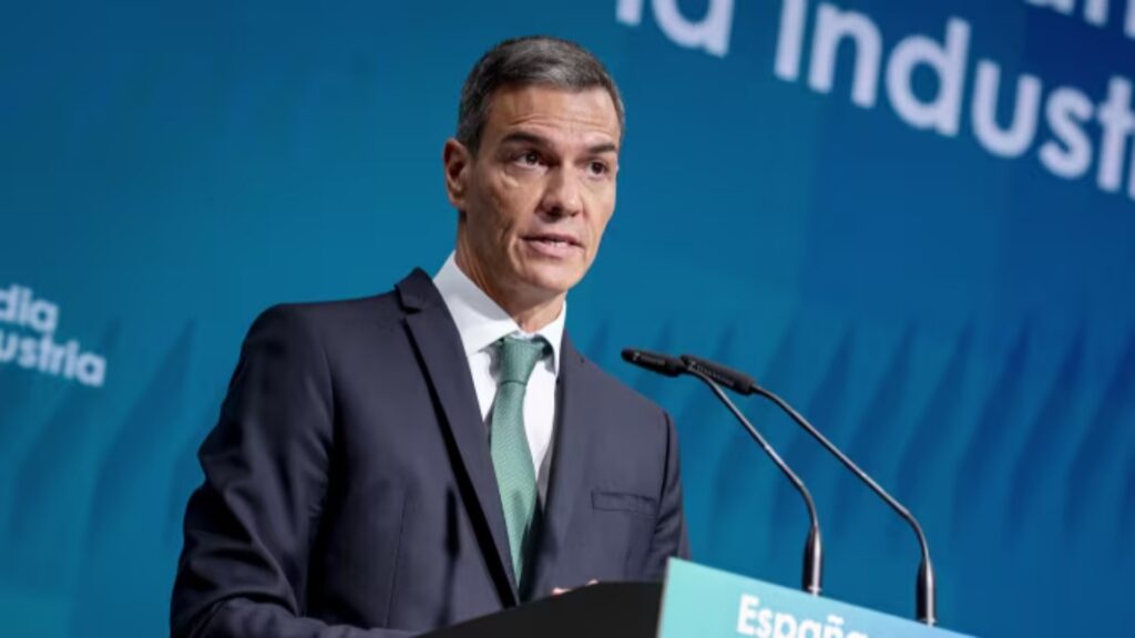 Spain’s Prime Minister Pedro Sanchez speaking at a podium.