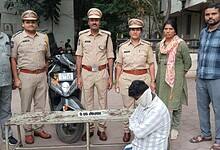 Telangana excise police along with the accused ( face covered) and Hash oil