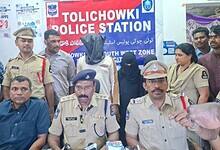 Police officers at Tolichowki Police Station in Hyderabad presenting suspects during a press conference