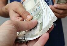 An officer taking a bribe.