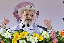 Amit Shah speaking at a political rally in West Bengal, emphasizing BJP's victory and anti-infiltration s.