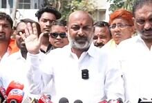 Union Minister speaking to supporters during GHMC election campaign in Hyderabad, focusing on voter suppo.
