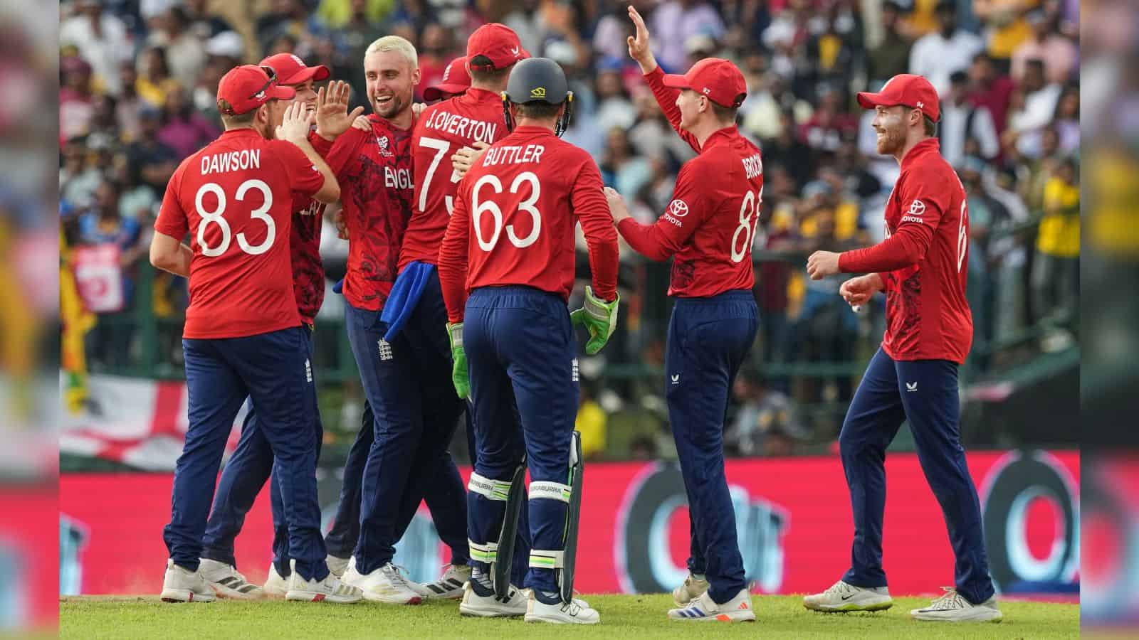 England cricket players celebrating after a wicket in T20 World Cup match.