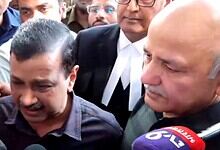 Kejriwal weeping with journalists and supporters after court clears him in excise case.