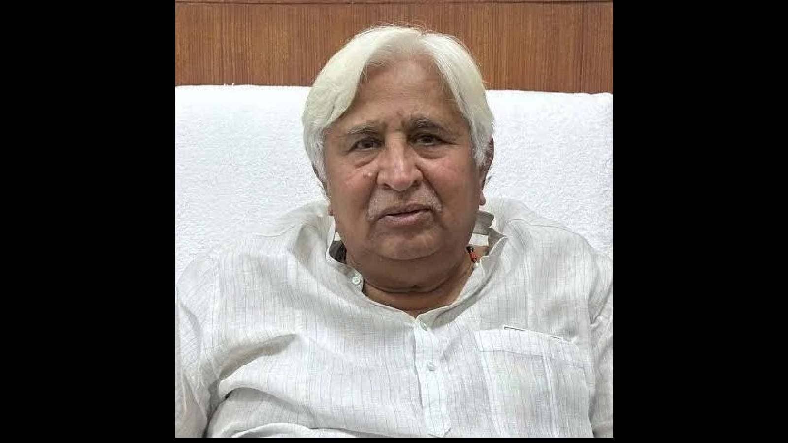 Rohith Vemula, an Indian scholar, in a white shirt, seated indoors, related to recent political discussio.