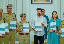 The image shows Telangana CM A Revanth Reddy releasing a book on the 1st Telangana Conference for Women in Police, and the RBVRR TGPA Annual Magazine–2025 at the Secretariat on Friday, February 27, 2026.