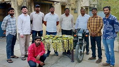 Group of men with seized ganja milkshake in Hyderabad police operation.