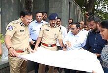 Hyderabad Comissioner of Police V C Sajjanar looks at the map of H-CITI project