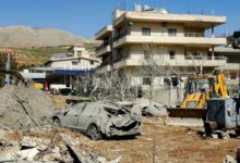 Bulldozer clearing debris near damaged buildings in Bednayel, Lebanon’s Bekaa Valley.