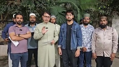 Community leaders and activists gathered outdoors for a discussion.