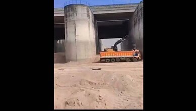 Heavy machinery engaged in sand mining under Telangana's Annaram barrage.