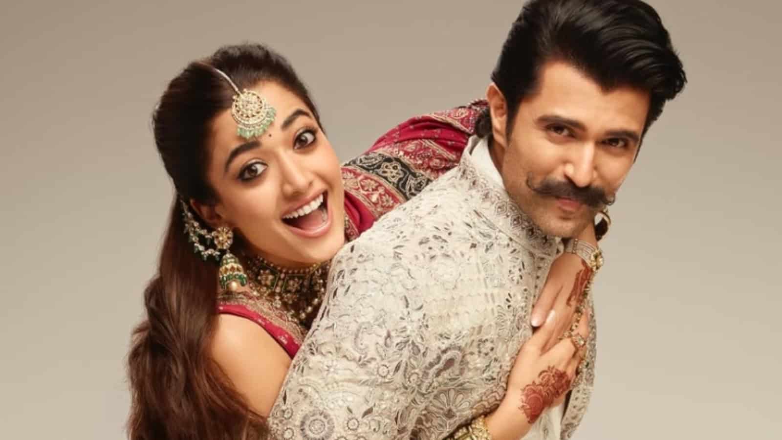 Vijay and Rashmika smiling at the Taj Krishna reception event.