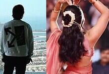 Portrait of a male Tollywood actor looking over a cityscape.