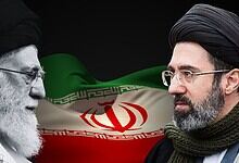 Two Iranian men, one older with a white beard and the other younger, face each other with Iran's flag in.