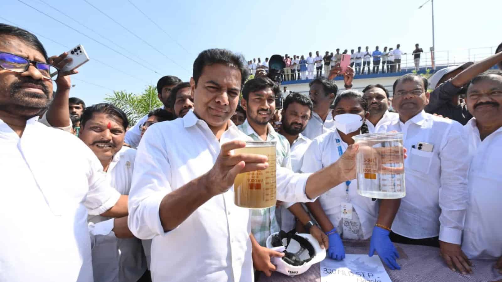 KTR holding water samples during a public event in Telangana, criticising Congress over 'bulldozer model'.