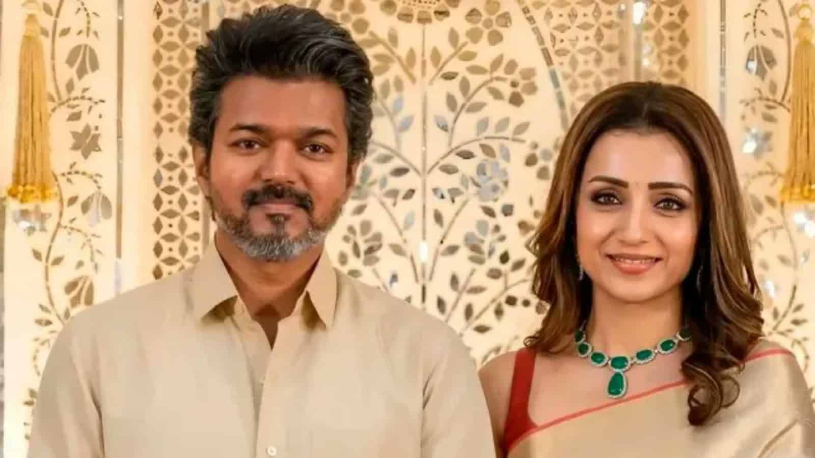Trisha and Thalapathy Vijay together, celebrating a special moment.
