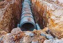 Image shows a drainage pipe in the ground