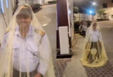 Security guard wears mosquito net