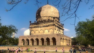 Ancient heritage monument in Telangana with visitors exploring the site.