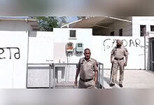 Punjab AAP workers write 'Gaddar' outside Harbhajan Singh's house in a political protest.