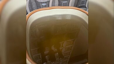 Yellowish drinking water in a household container in Manikonda.