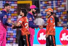 Indian and Pakistani cricket players shake hands before the match at the stadium.