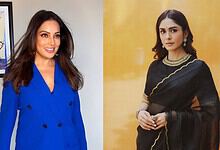 Mrunal Thakur smiling in a blue outfit at a media event.