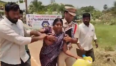 Woman attempting suicide over housing issue in Suryapet, surrounded by helpers.