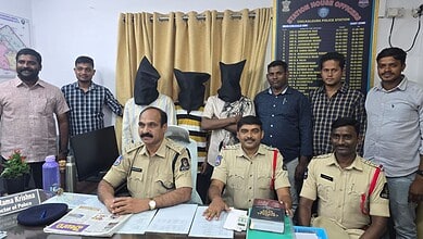Group of police officers and civilians in a police station office in India.