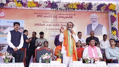 The image shows Malkajgiri MP Eatala Rajender addressing a gathering after laying foundation-stone for the Road Under Bridge at Vajpayee Nagar in Malkajgiri on January 27, 2026.