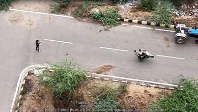 Drone captures risky bike stunts on Hyderabad road, with police monitoring the scene.