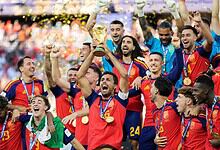 Spain football team celebrating with trophy after winning FIFA World Cup.
