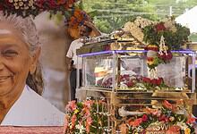 Tribute to S Janaki with floral arrangements and a portrait at her cremation in Mysuru.