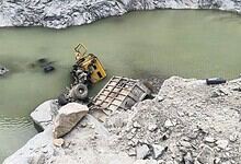 Lorry submerged in quarry water after accident in Tumakuru, India.