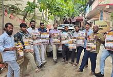 Group of men holding newspapers outdoors in Telangana for a gig event.