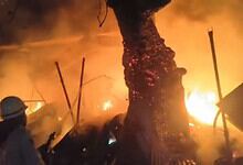Fire engulfs shops near a tree in Nalgonda, causing extensive damage during a fire incident.