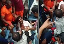 Three men beaten on a moving train, surrounded by onlookers, in a tense scene.