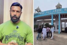 Mohammad Deepak speaking against demolition at Jauhar University entrance.