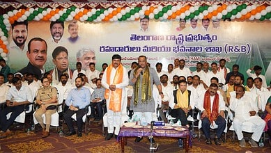 Vikarabad road development event with local officials and leaders, decorated with green, white, and saffr.