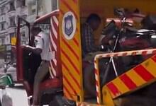 Police officials pushes a delivery agent away after seizeng vehicle in Hyderabad