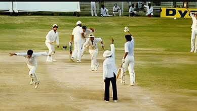 Cricket players celebrating on the pitch during a match at The Siasat Daily event.