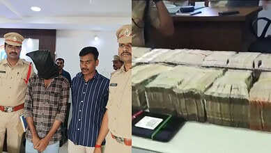 Man held for burglary in Hyderabad with Rs 24.5 lakh recovered, surrounded by police officers.
