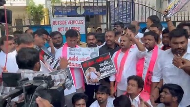 BRS MLAs protest outside Hyderabad ED office during detention, holding placards and banners.