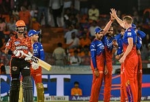 Royal Challengers Bengaluru players celebrate the wicket of Sunrisers Hyderabad batter Bhuvaneshwar Kumar during the Indian Premier League (IPL) 2024 match between Sunrisers Hyderabad and Royal Challengers Bengaluru, at Rajiv Gandhi International Cricket Stadium, in Hyderabad