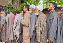 Voters line up outside polling stations in J&K's Srinagar LS seat