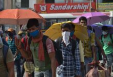 As Hyderabad is witnessing alarming heatwave on Sunday the migrants who are waiting in queue at Secunderabad railway station to board Sharmik special trains to get to their home states seen holding umbrella to umberal protect themselves from sunlight. Photo: Mohammed Hussain