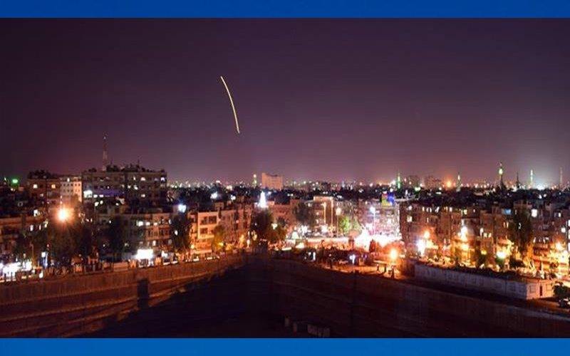 Syrian state media broadcast footage of what it said were its air defences lighting up the night sky