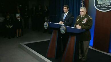US forces take two men into custody during Baghdadi raid