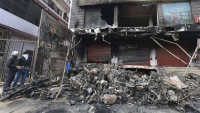 New Delhi: Charred remains of vehicles set ablaze by rioters during communal violence over the amended citizenship law, outside an auto showroom in Khajuri Khas of Northeast Delhi, Friday, Feb. 28, 2020. (PTI Photo/Manvender Vashist)