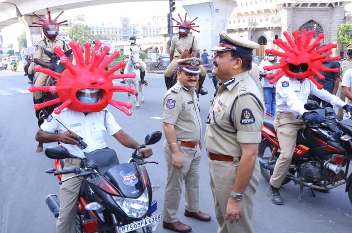 Cops wear coronavirus helmets to persuade people to stay home
